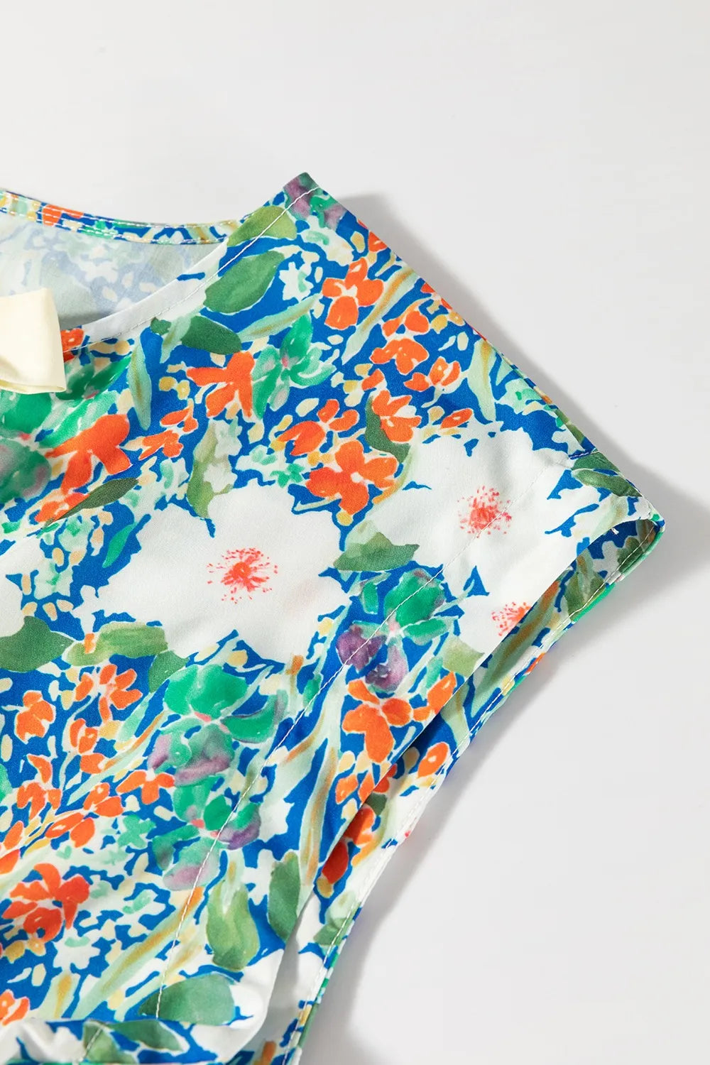 Floral Print Bow Applique Slit Sleeveless Peplum Blouse - Concordia Style Boutique