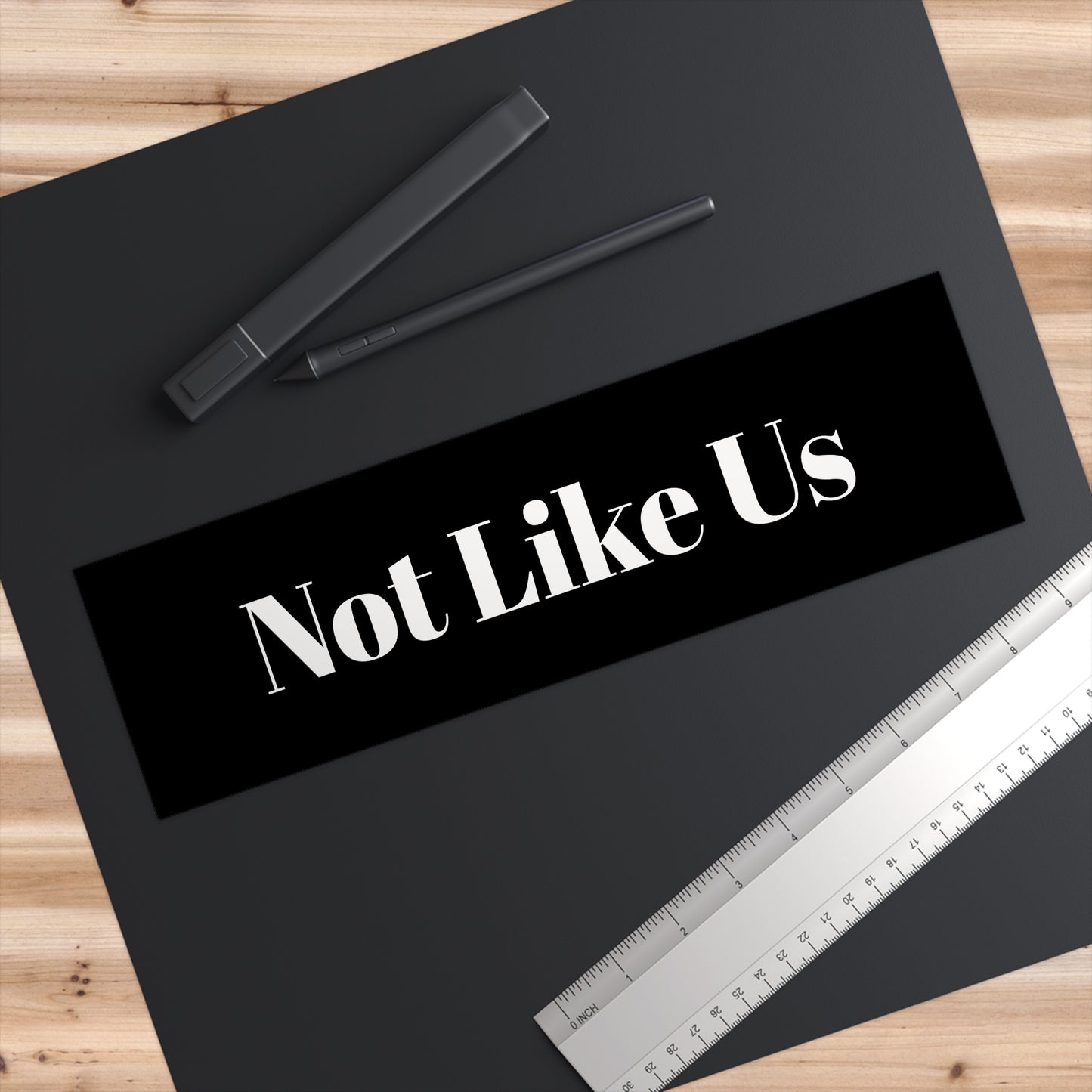 "Not Like Us" - Bumper Stickers - Perfect for Unique Souls, Car Decor, Gift for Friends, Road Trip Essentials, Customizable Car Art - Premium Bumper Stickers from Concordia Style Boutique - Just $15.16! Shop now at Concordia Style Boutique