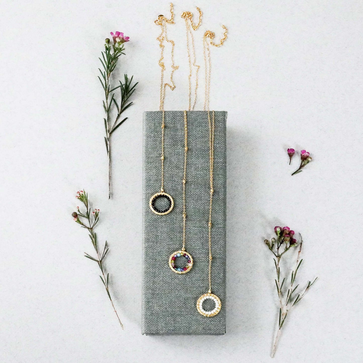 Black Spinel, Rainbow Gemstone and Pearl Halo Y Pendants